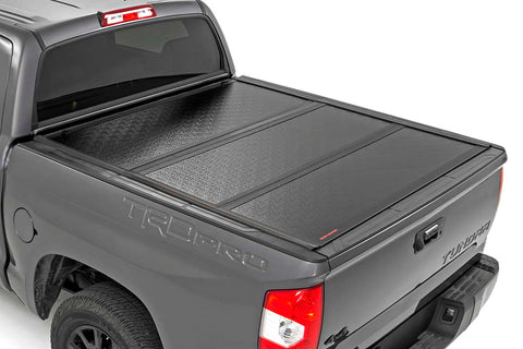 Toyota Low Profile Hard Tri-Fold Tonneau Cover (02-19 Tundra 5.5ft Bed W/ Factory Cargo Management System)